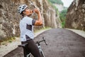 road bike cyclist take a brake and drink a bottle of water Royalty Free Stock Photo