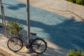 The road and the bike locked up to apole