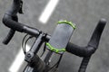 Road bike with smartphone on handlebars