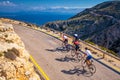 Road bikers on the road on Balearic Islands. Sea in Background. Cap de Formentor. Mallorca, Majorca, Spain Royalty Free Stock Photo