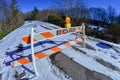 Road block set up before snowy and icy road Royalty Free Stock Photo