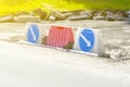 Road bollards plastic overlaps and road signs with arrows on a blue background - detour to the right.