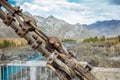 Road bridge over the river in the mountains, metal structure close-up. Location Gorny Altai, Siberia, Russia