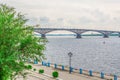 Road bridge over the Volga river between Saratov and Engels, Russia. Cloudy summer day. City quay Royalty Free Stock Photo