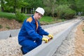 Road builder checks the correctness of the work carried out using the building level