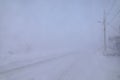 Road and buildings disappearing under blizzard conditions Royalty Free Stock Photo