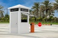 Road Car Barrier and Security Zone Booth with Security Sign in Empty City Street with Palm Trees. 3d Rendering Royalty Free Stock Photo