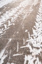 Road with car tracks in the snow