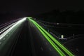 Road with car traffic at night with blurry lights