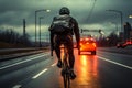 Road carriageway, cyclist shares space with moving cars, riding