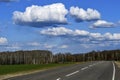 Road without cars with clouds