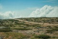 Road with cars passing through rocky landscape Royalty Free Stock Photo