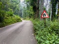 Road cautionary sign indicating right reverse bend ahead. Sign indicating right hair pin bend