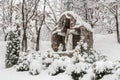 Road chapel covered with snow. Each passing may refer to God.