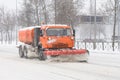 Road cleaning snow-removing machine in the city after huge snowfall.