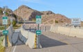 Road closed and barricaded on Davis Dam. Bike Access Signs showing bicycling and walking allowed on the Davis Dam road, on the bor Royalty Free Stock Photo