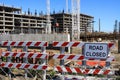Road Closed Sign with Construction Site in the Background Royalty Free Stock Photo