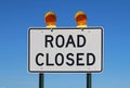 Road closed sign against a bright blue sky Royalty Free Stock Photo