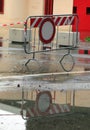 Road closed sign due to flooding after a citywide downpour