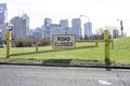 Road closed sign in Philadelphia with city in the background Royalty Free Stock Photo