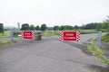 Road closed sign on swing gate at entrance to private business estate in rural countryside Royalty Free Stock Photo