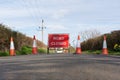 Road Closed sign with traffic cones on country road. UK