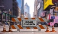 Closed road text sign, street barriers and traffic cones downtown, city center background. 3d illustration Royalty Free Stock Photo