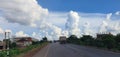 Road clouds blue sky