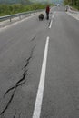 Road collapses with huge cracks. International road collapsed down after bad construction. Damaged Highway Road. Asphalt road.