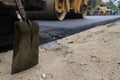 Road construction asphalt road by worker and roller machine. Asphalt road background Royalty Free Stock Photo
