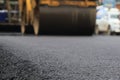 Road construction asphalt road by worker and roller machine. Asphalt road background Royalty Free Stock Photo