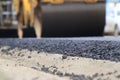 Road construction asphalt road by worker and roller machine. Asphalt road background Royalty Free Stock Photo