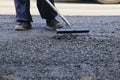 Road construction asphalt road by worker and roller machine. Asphalt road background Royalty Free Stock Photo