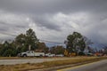 Road construction crew work with storm clouds Royalty Free Stock Photo