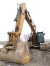 Road construction equipment: yellow caterpillar excavator Royalty Free Stock Photo