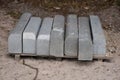 Road construction materials stacked on a pallet. Concrete curb f Royalty Free Stock Photo