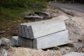 Road construction materials stacked on a pallet. Concrete curb f Royalty Free Stock Photo