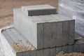 Road construction materials stacked on a pallet. Concrete curb f Royalty Free Stock Photo