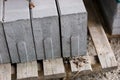 Road construction materials stacked on a pallet. Concrete curb f Royalty Free Stock Photo