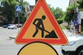 Road construction sign on city street, closeup. Repair works Royalty Free Stock Photo