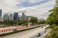 Road with construction site and cityscape, Kuala Lumpur