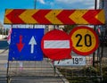 Road construction street signs close up shot, blue sky with white clouds