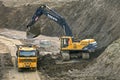 Road construction with truck and excavator Royalty Free Stock Photo