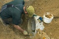 Road Construction Worker laying new sewer pipe Royalty Free Stock Photo