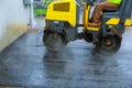 Road construction works with roller compactor machine and asphalt finisher asphalt parking for the car Royalty Free Stock Photo