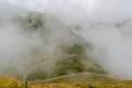 The road that crosses the Fagaras mountains seen from above among the fog, Transfagarasan, Romania Royalty Free Stock Photo