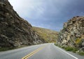 Road curve through mountains in california desert