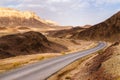 Road and curve in sandstone desert landscape, Israel