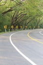 The road curve with street signs reflex light. Royalty Free Stock Photo