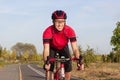 Road Cycling Ideas. One Emotional Male Cyclist Riding Road Bike Uphill Equipped with Summer Bike Outfit Posing Outdoor During Royalty Free Stock Photo